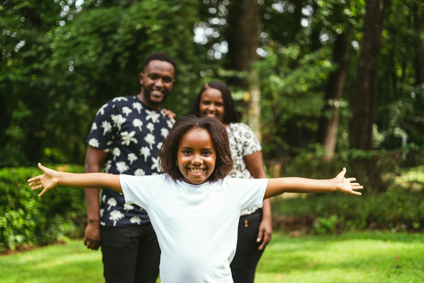 Young Kenyan family outdoors - personal insurance cover from Mufasa Insurance